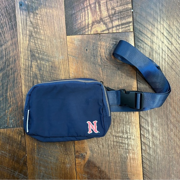 Blue and Red Crossbody Bag with Durable Fabric and Adjustable Strap - Picture 1 of 5